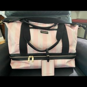 Gently used. Some markings. Weekender bag, pink and white striped.